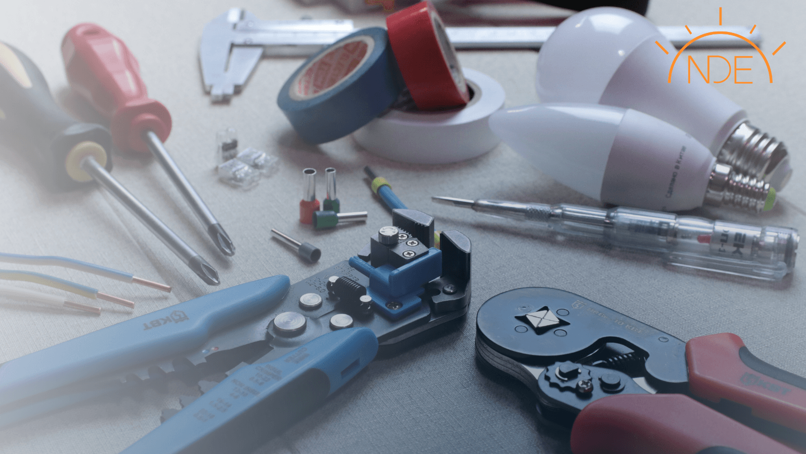 Commercial electrical work tools on a table at a commercial remodel job site.